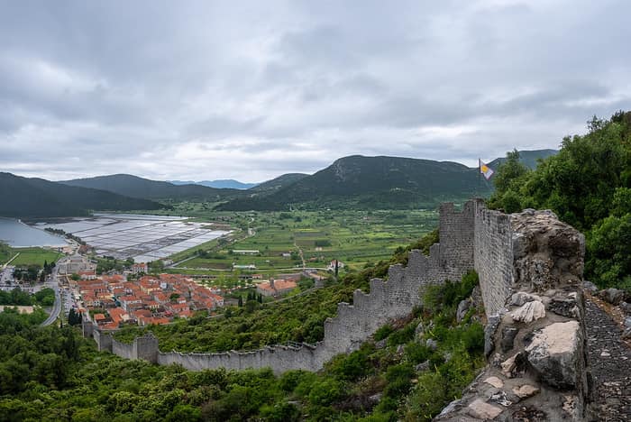 The walls with the town and the salt pans in the background