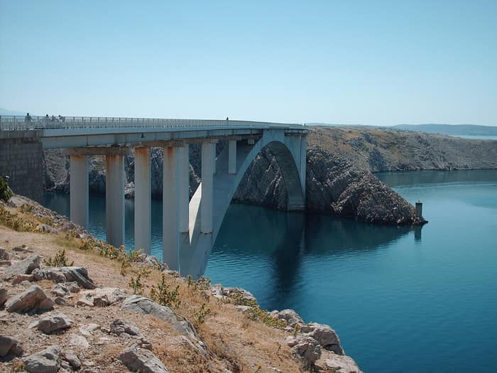 The Pag Bridge, a slender concrete arch spanning the Adriatic strait of Ljubačka Vrata