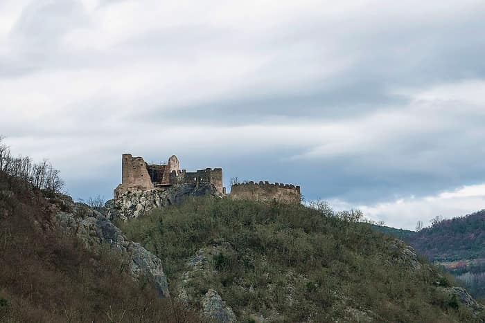 The ruined castle of Pietrapelosa, also called Kostel, on its crag above the Bračana valley