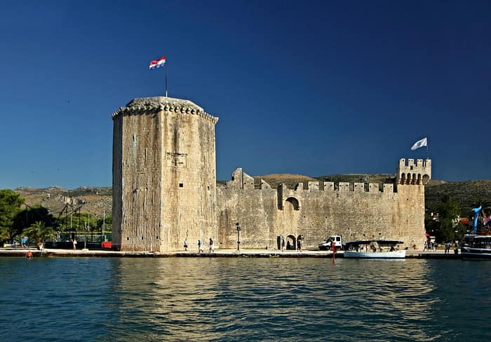 Kamerlengo Castle in Trogir seen from the sea, with its polygonal tower facing the water