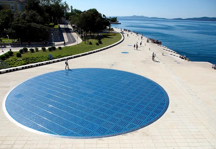 The Monument to the Sun on the Zadar waterfront, a circle of glass plates set into the stone paving and lit up